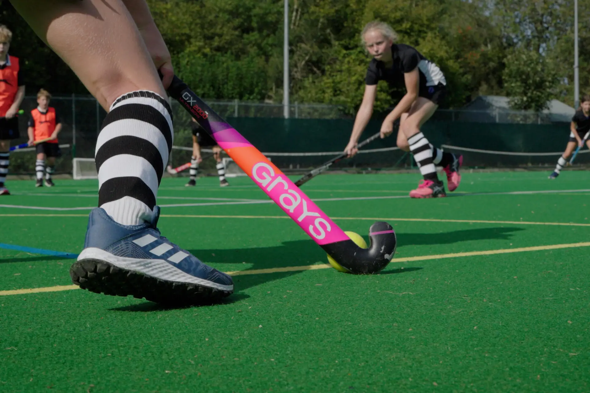 Image of pupils playing hockey