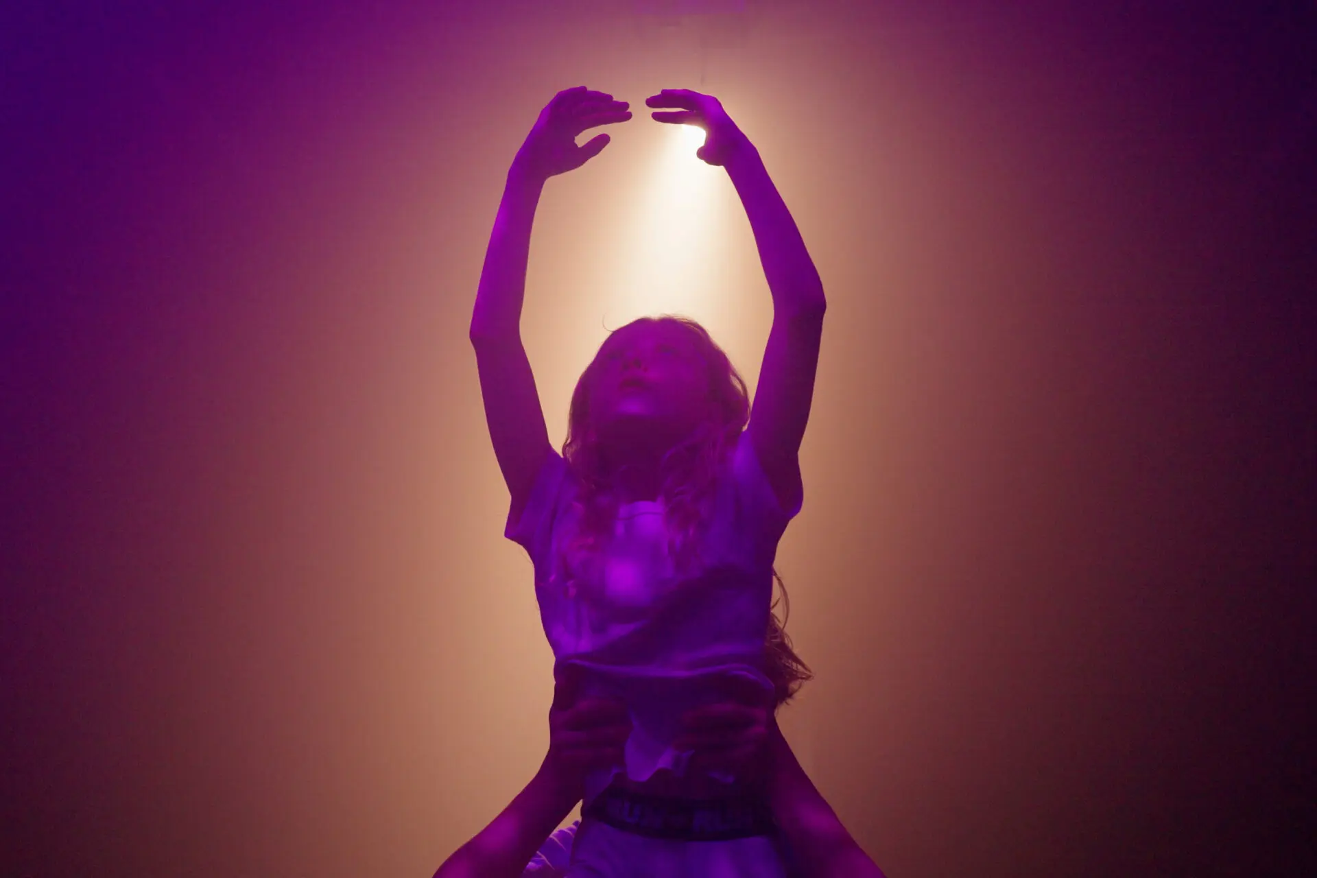 Image of a female pupil dancing on stage