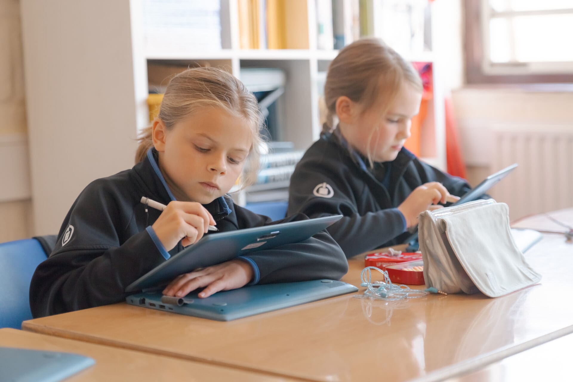 Image of 2 pupils using computers