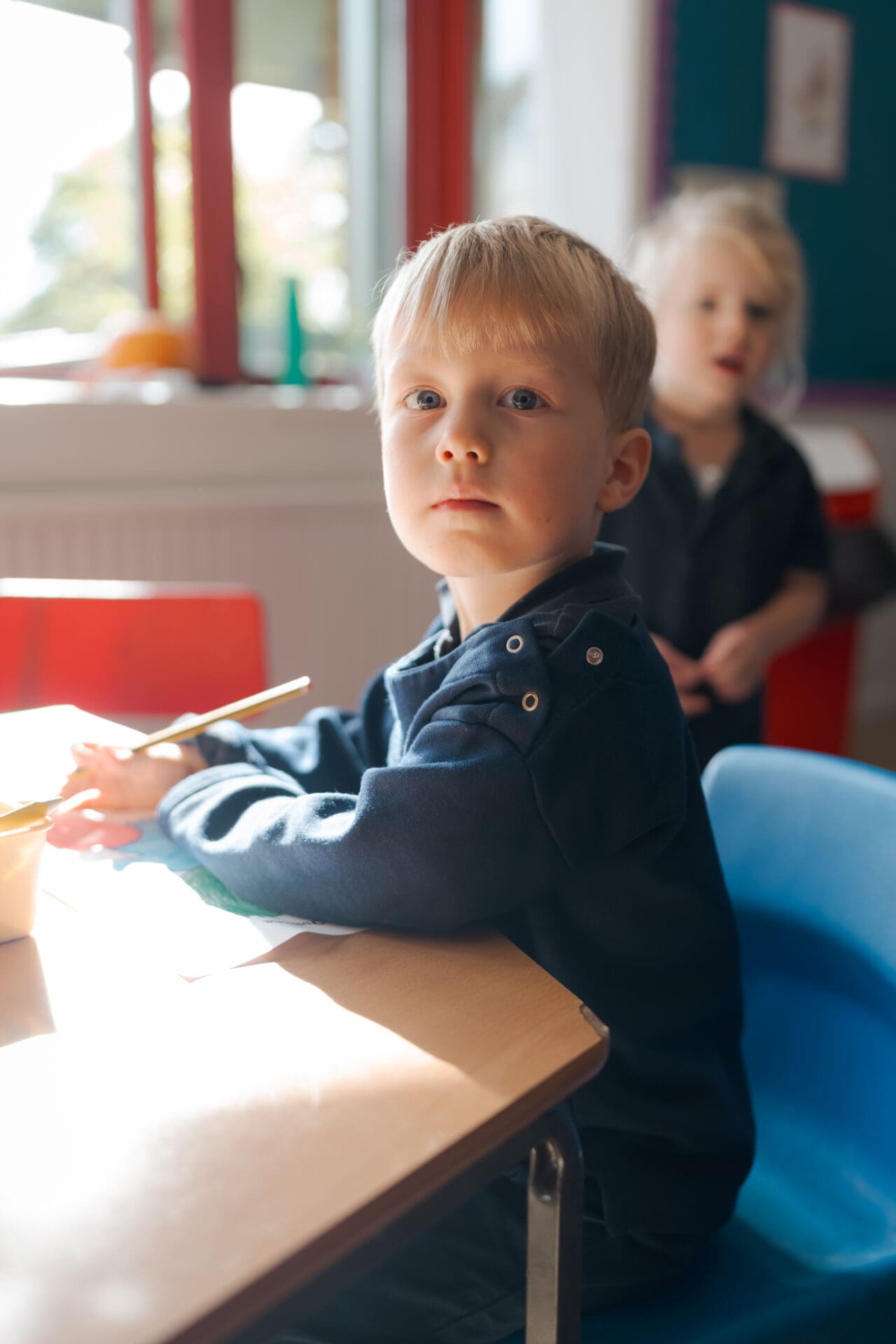 Image of a prep-school boy looking into the camera